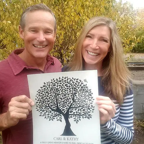 Carl & Kathy community mentors displaying their award